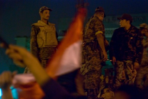 Egyptian army watches Egyptians on February 11